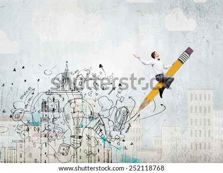 Young businessman riding pencil and business sketches at background