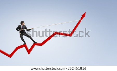 Businessman pulling arrow with rope and making it raise up