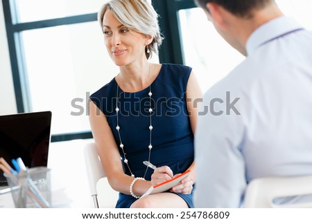 Attractive business woman in office