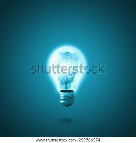Conceptual image with light bulb and gears inside
