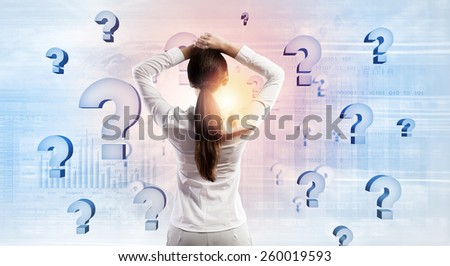 Rear view of businesswoman with hands on head thinking something over