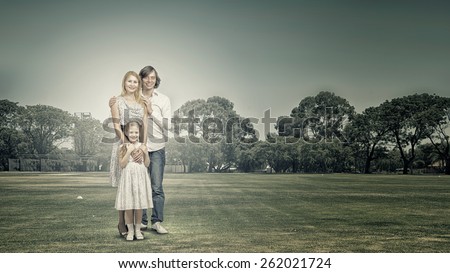 Happy family of mother father and daughter