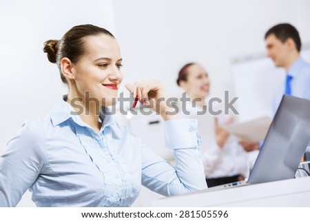 Businessman and businesswoman in office having conversation