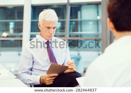 Two businessmen during interview in office
