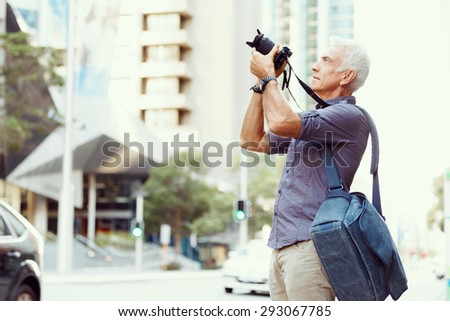 Similar – Image, Stock Photo Casual tourist making photo on smartphone of nature