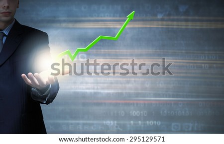 Close up of businessman hand holding increasing graph