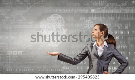 Attractive businesswoman holding in palm working gears mechanism