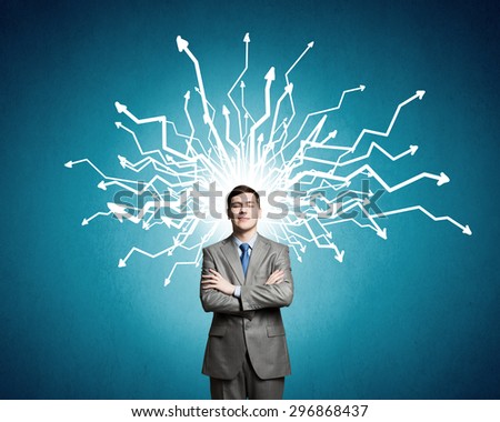 Young confident businessman with hands on head