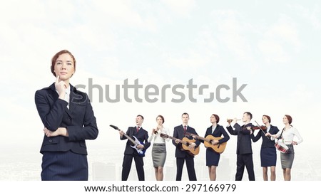 Young woman in suit playing different music instruments