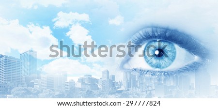 Bird eye view of modern city with human female eye