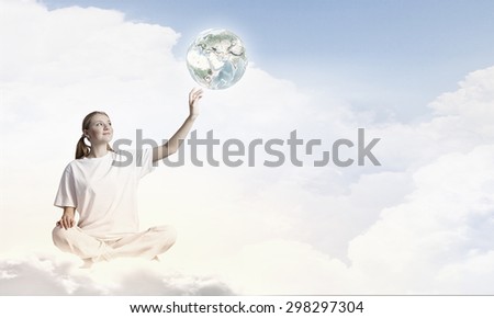 Young woman representing soul balance and meditation concept. Elements of this image are furnished by NASA