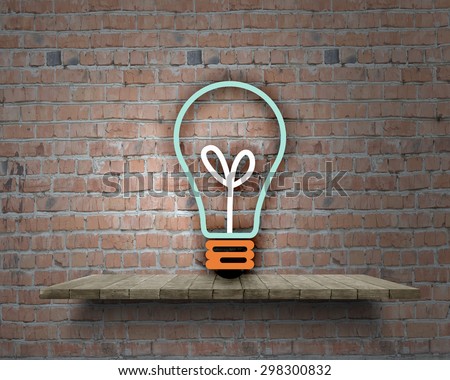 Conceptual image of light bulb on wall with sketches of ideas