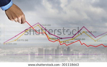 Hand of businessman drawing with pencil increasing graph