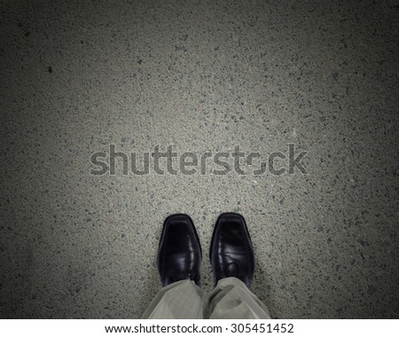 Top view of businessman legs choosing his way