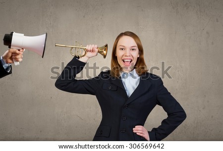Businessman using megaphone to scream agressively at woman