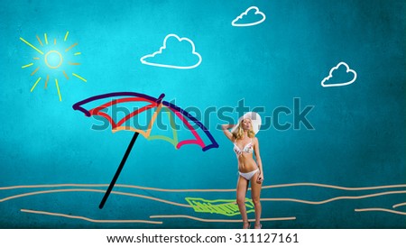 Young hot woman in hat and bikini on colorful background