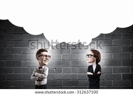Young funny big headed man and woman in glasses