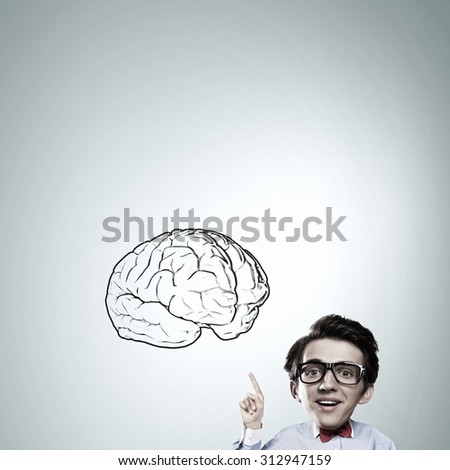 Idea concept with businessman with big head pointing at big  brain