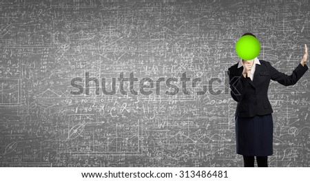 Businesswoman hiding her face behind paper mask with question sign and showing stop gesture