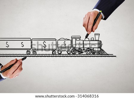 Close up of male hand drawing transportation train