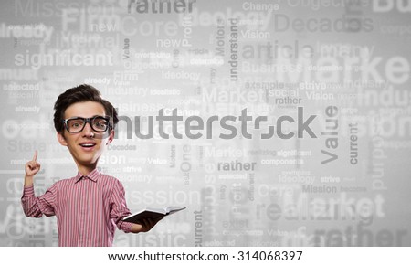 Young funny man in glasses with big head and book in hands