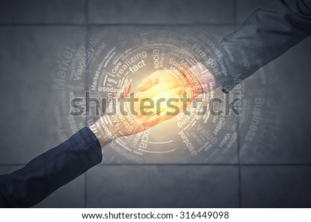 Top view of a businessman and woman shaking hands in office lobby