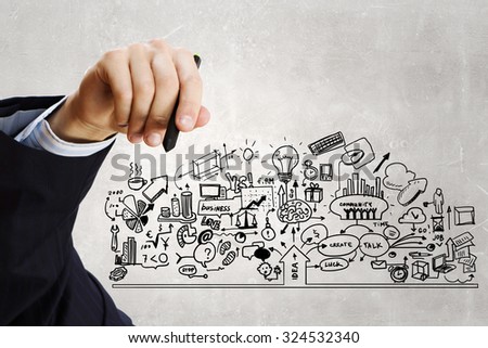 Close up of businessman drawing business sketches on screen