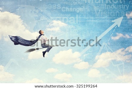 Young businessman flying on broom and growth concept
