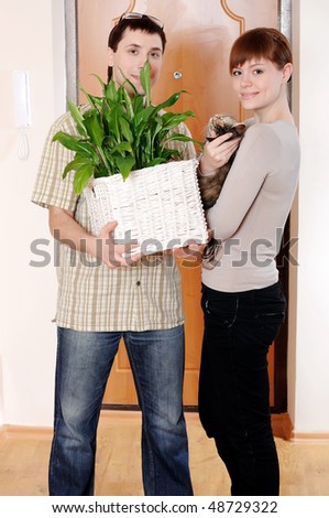 a charming young couple settlers went into their new apartment.Young couple thrilled