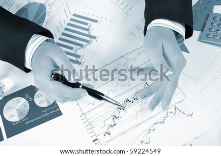 Workplace businessman. Charts, securities, charts on your desktop