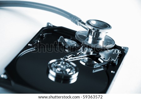 Computer hard drive and a stethoscope. The symbol of health equipment.