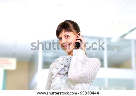 Young business woman in an office at the workplace.