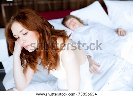 picture of couple in disagreement in bedroom