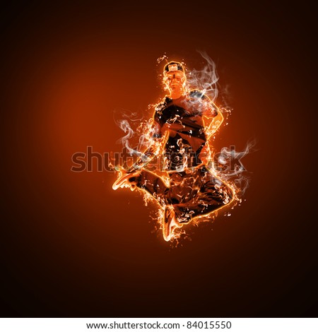 Flame and fire dancer against black background