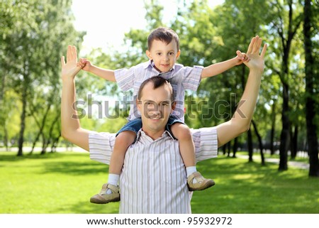 Father with his son in the summer park