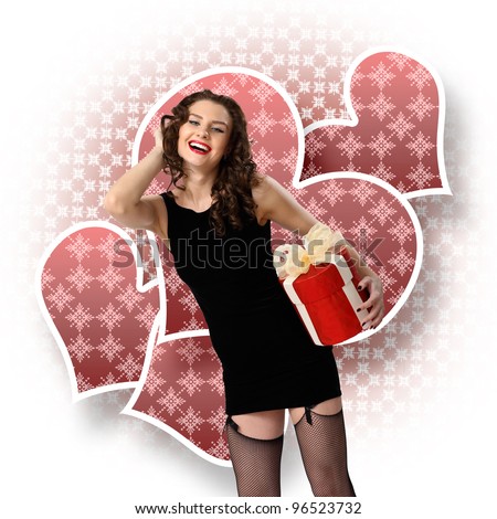Young pretty woman in black dress with a gift box