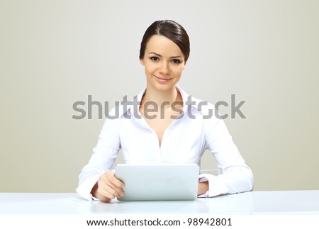 POrtrait of a young beautiful woman in business wear at work