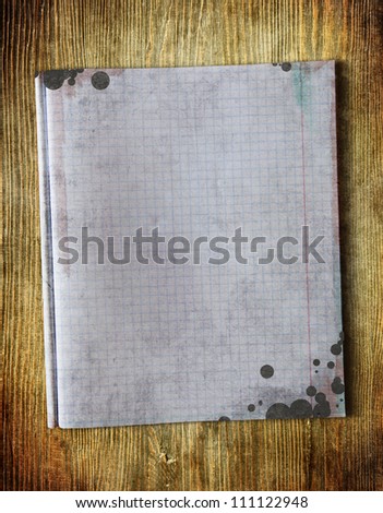 Vintage notepad paper on wooden table