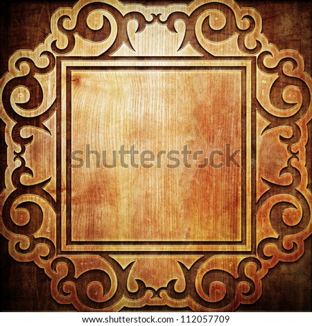 carved frame ornament on wooden texture