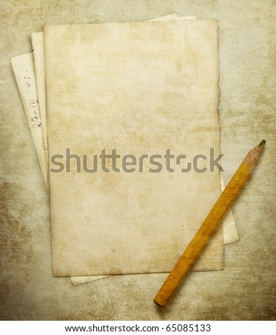 Vintage background with pencil and paper