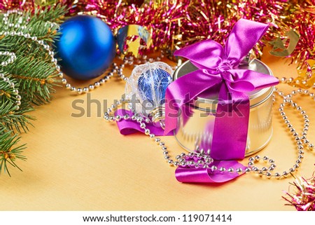 New Year present and decorations on yellow background