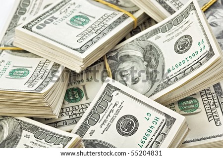 Many  bundle of US 100 dollars bank notes
