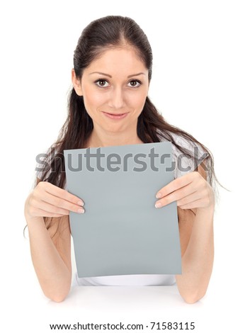 Young beautiful girl holding blank gray card isolated on white