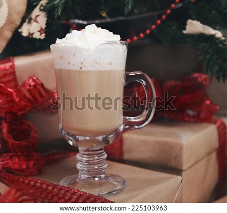 Hot chocolate with presents under the Christmas tree