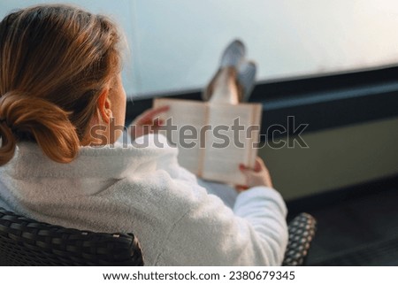 Similar – Image, Stock Photo balcony Reading Literature