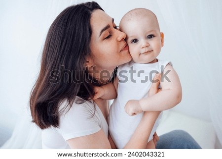 Similar – Image, Stock Photo Young mother and child hugging. Mothers day