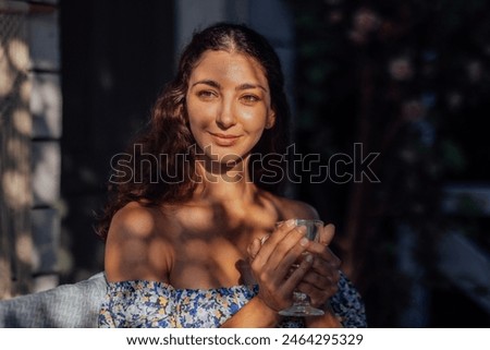 Similar – Image, Stock Photo Charming woman in light white dress on wavy beach