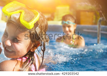 Similar – Image, Stock Photo Two little girls play on rocky northern seashore. Sit, laugh, hug, explore the coastal rocks. Travel and enjoy a great adventure in Norway. Beautiful view of fjord and mountains in sunset.