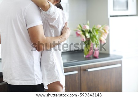 Similar – Image, Stock Photo Couple kissing in kitchen on counter