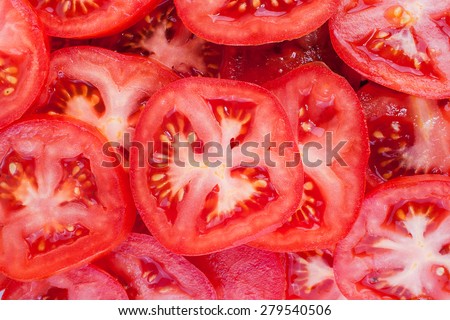an image of Tomato slices. Natural background with slices of tomato.